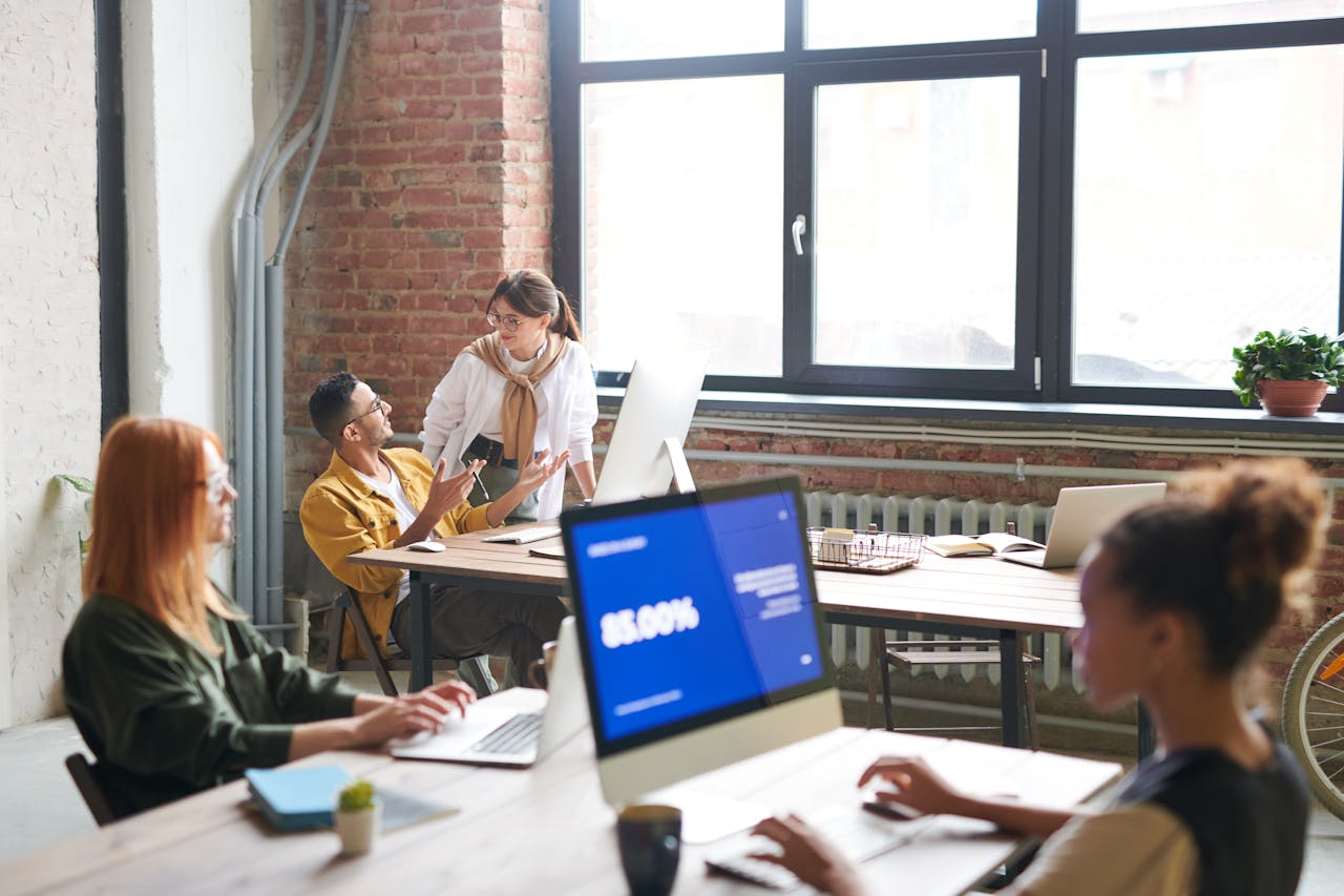 A diverse group of professionals collaborating in a creative modern office environment.